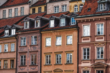 Fototapeta na wymiar old beautiful town houses; Sights of Warsaw;colorful houses with windows;