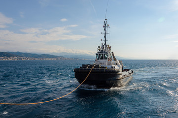 Tug boat with towing rope