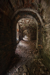 Fototapeta na wymiar weathered dark corridor of old fortress