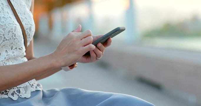 Close up of woman use smart phone at outdoor