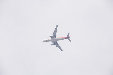 Passenger Airplane flying under the sky
