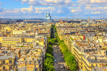 Fototapeta na wymiar Aerial view of Paris skyline from Arc de Triomphe in a beautiful sunny day with blue sky. Avenue de Wagram from Triumphal Arch. Paris Capital of France in Europe. Scenic urban cityscape.