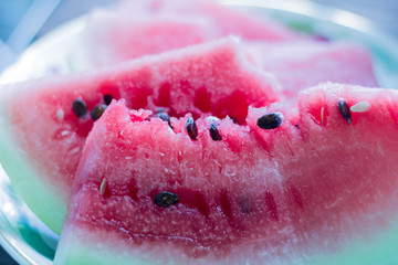 juicy watermelon slices on wooden background