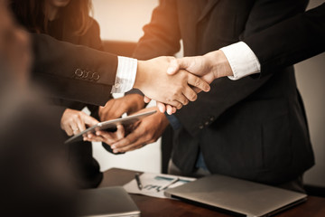 Business people join hands to congratulation the business deal. Business handshake.