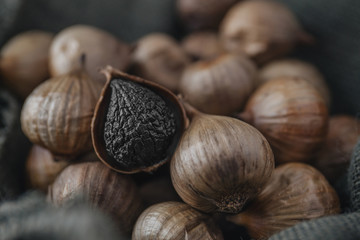 Black garlic with rustic background