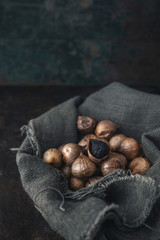 Obraz premium Black garlic with rustic background