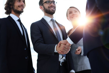 business leader shaking hands with the investor