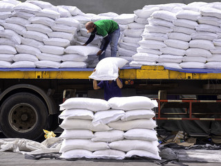 The truck delivery sugar in bag to store in warehouse and pick up by labor