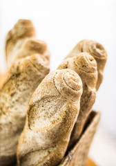 mixed french organic french baguette bread in bakery display