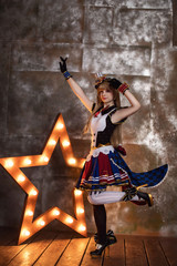Cosplay of school idol / young cute beautiful girl anime cartoon staying near big star