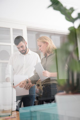 Couple standing in an office using a copier