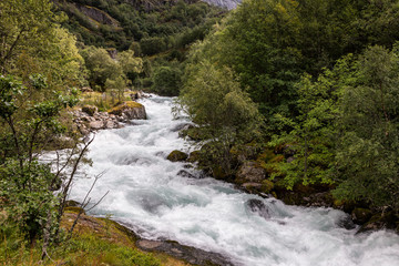 Fototapeta na wymiar Small waterfall in Norway. Briksdalsbreen.