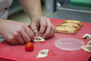 The cook prepares canapés