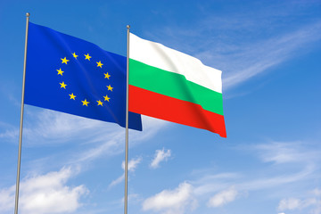 European Union and Bulgaria flags over blue sky background.