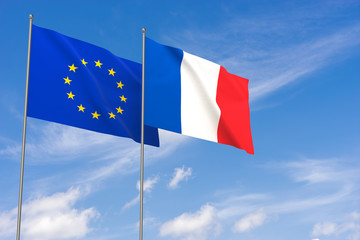European Union and France flags over blue sky background.