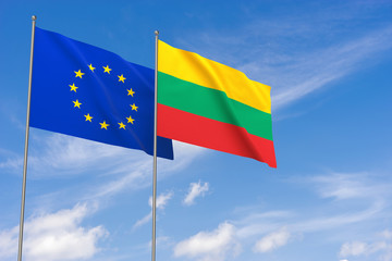 European Union and Lithuania flags over blue sky background.