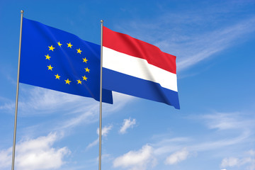 European Union and Netherlands flags over blue sky background.