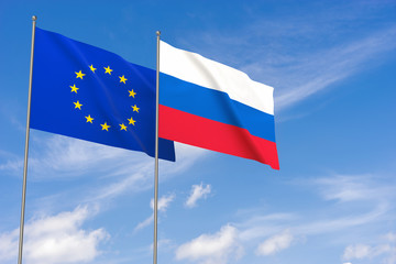 European Union and Russia flags over blue sky background.