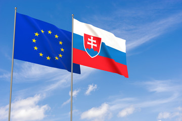 European Union and Slovakia flags over blue sky background.