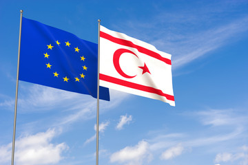 European Union and Turkish Republic of Northern Cyprus flags over blue sky background.