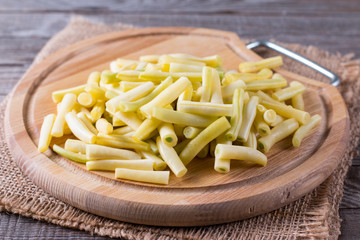 Chopped Raw Beans on a Wooden Cutting Board