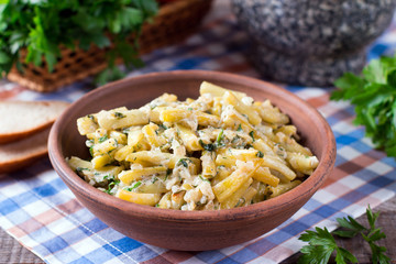 Cooked green beans in sour cream with greens in a plate