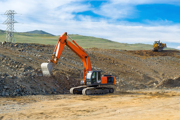 Excavator and bulldozer build a new road 