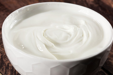close up of a white whipped or sour cream in bowl.