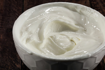 close up of a white whipped or sour cream in bowl.