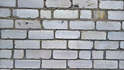 white brick wall with cement seams