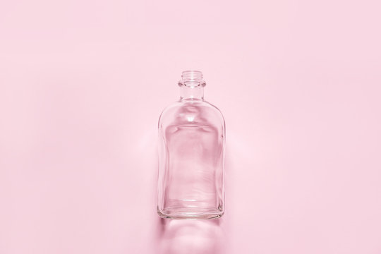 Flat bottle isolated on pink background