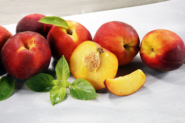 Fototapeta na wymiar A group of ripe peaches on table