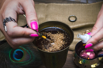  Witch prepares a magic potion. Fortune teller table. Divination. Witchcraft.