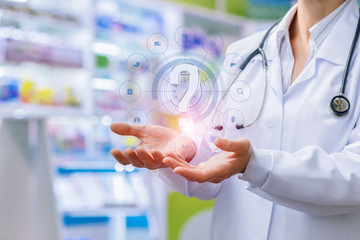 Pharmacist shows in the hands of a question mark .