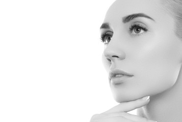 Fototapeta premium Black and white Beauty woman face portrait. Beautiful spa model girl with perfect fresh clean skin. Youth and skin care Concept. Isolated on a white background
