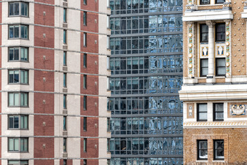 Closeup pattern of modern skyscraper buildings architecture in New York City NYC aerial view through window, vertical lines, windows