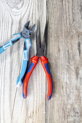 Old working tool on a wooden background