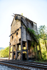 Abandoned retro vintage concrete loading receiving terminal building exterior in Thurmond, West...
