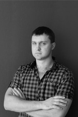 young man in shirt and jeans. portrait of man. black and white male portrait photos