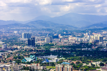 Fototapeta na wymiar Kuala Lumpur city skyline with mountains, Malaysia