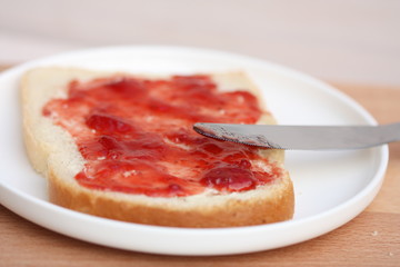Bread with strawberry jam.