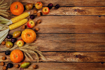 Fototapeta na wymiar Autumn vegetable and fruit wood background