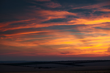 beautiful sunset is in the whetaen field, colorful sky with clouds