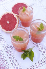 Pink grapefruit juice and mint in glasses