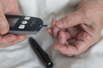 old people step by step measuring diabetes. Testing for high blood sugar.