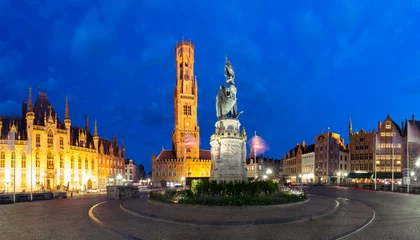 Foto op Canvas Tower Belfort and statue of Jan Breydel and Pieter de Coninck on the Grote Markt or Market Square during evening blue hour, Bruges, Belgium © Kavalenkava