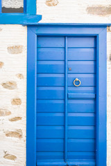 Vintage blue door in Syros island, Cyclades, Greece