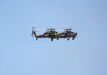 Fototapeta na wymiar Two combat helicopter in flight