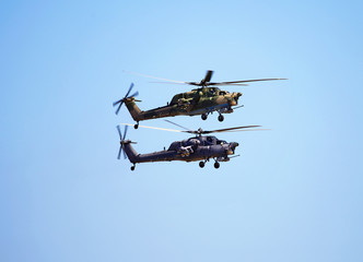 Two combat helicopters in flight