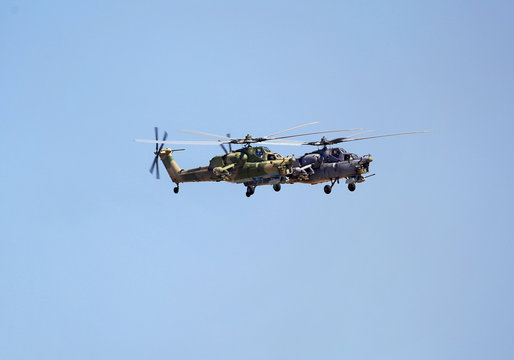 Two combat helicopter in flight